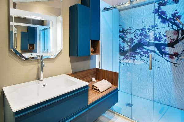 Gray Bathroom with Blue Patterned Wallpaper
