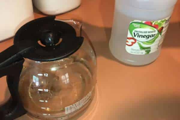 Mix Equal Parts Vinegar And Water In Carafe