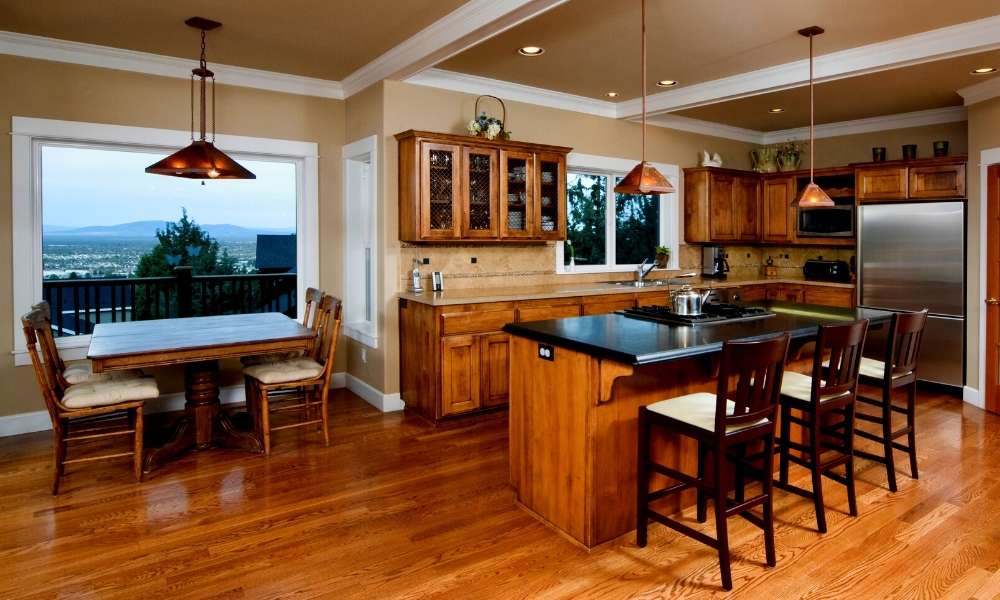 What color dining table with dark wood floors