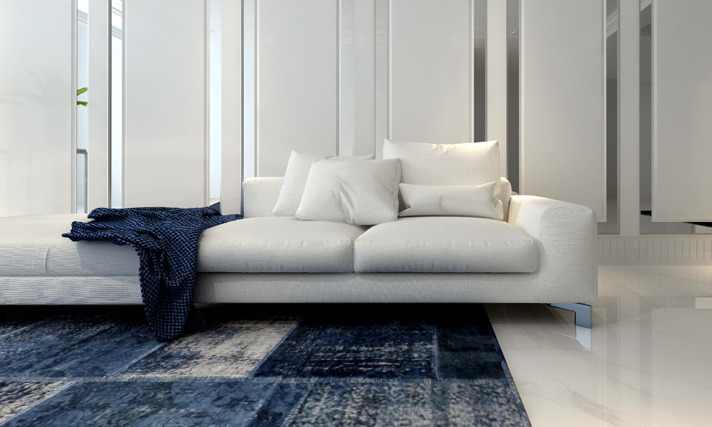 White Couch Against A Wood Paneled Wall