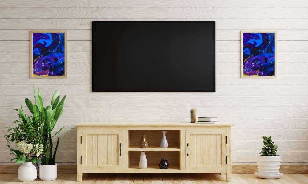 TV in a small bedroom using interesting artwork