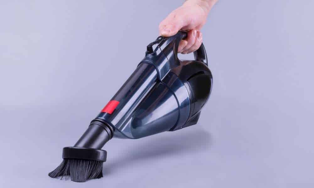 A Handheld Vacuum   To Clean Rattan Dining Chairs