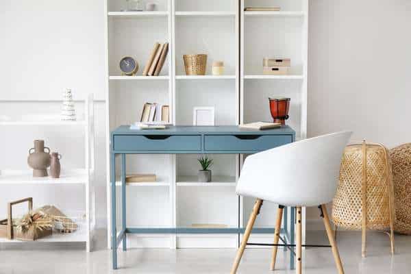 Built-in Desk With a Wooden Top Fitted With a Gray Desk Chair