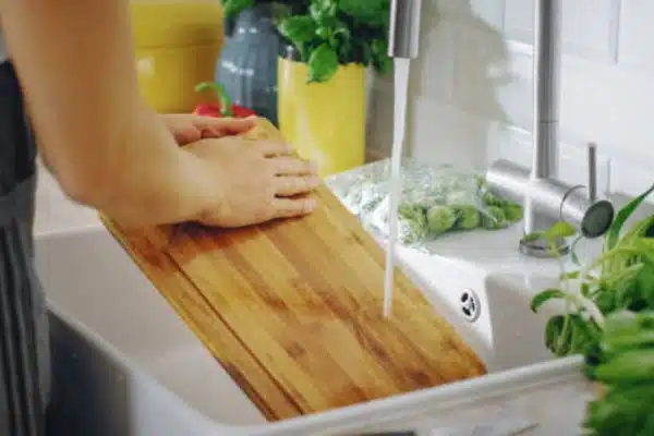 Rinse with Warm Water To Remove Stains From Cutting Board