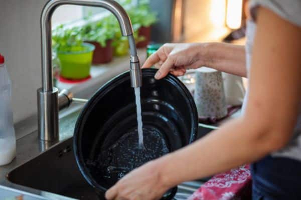 Soak the insert in warm, soapy water