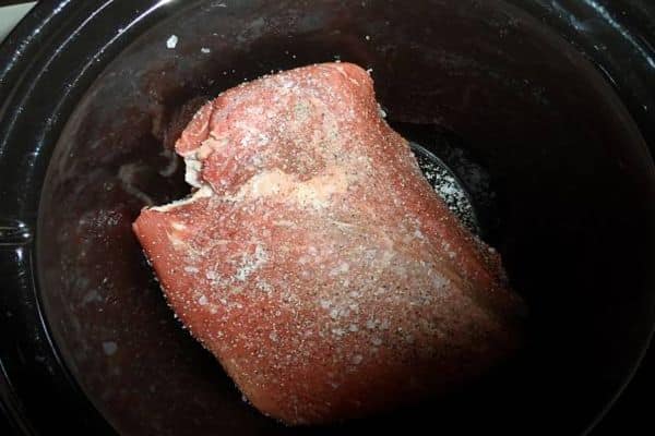 Unwrap and trim the ham to Heat Fully Cooked Ham in Slow Cooker